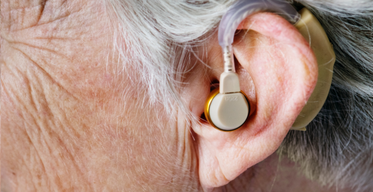 person ear with hearing aid 