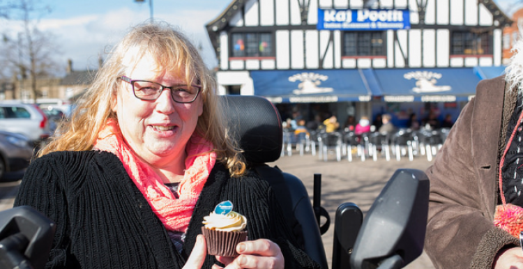 lady in a wheelchair with a cupcake 