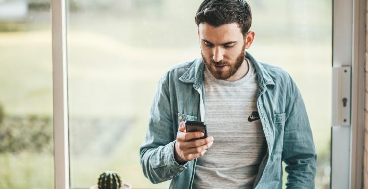 man looking at phone