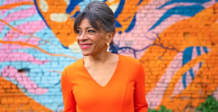 Older woman by street art