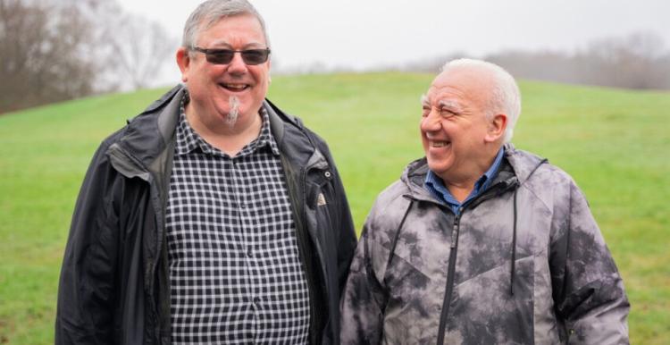Two men outside 