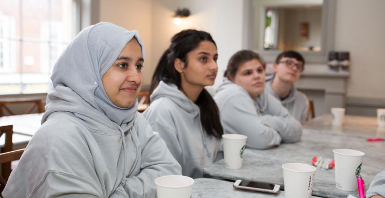 young-people-sat-at-a-table