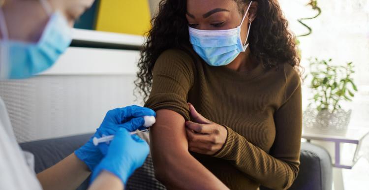 young woman having vaccine 