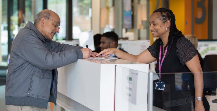 Man at a reception desk 