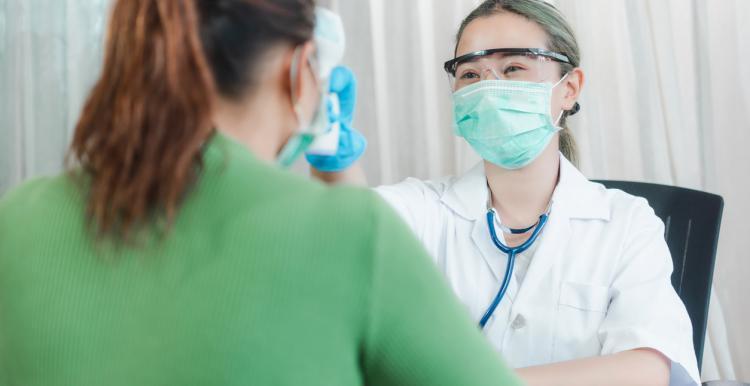 A female dental surgeon talking to a patient 