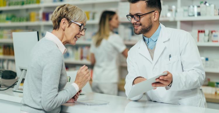 Pharmacist with a member of the public