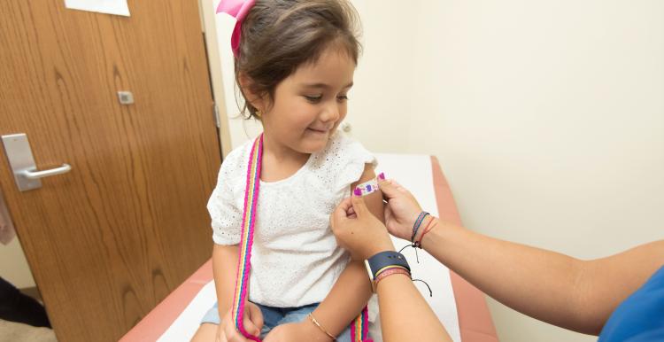 Young child having MMR vaccine 