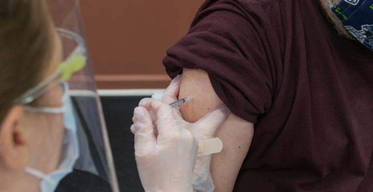 Person receiving vaccination