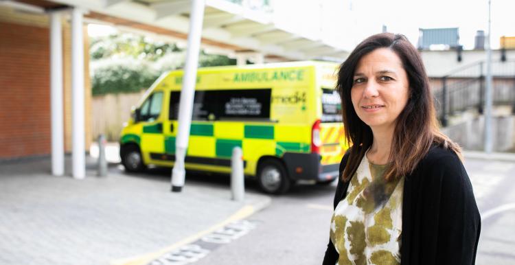 Woman in front of a emergency department 