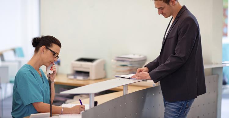 man at a reception desk 