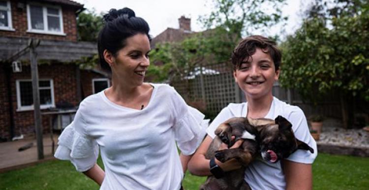 woman and young person with a dog