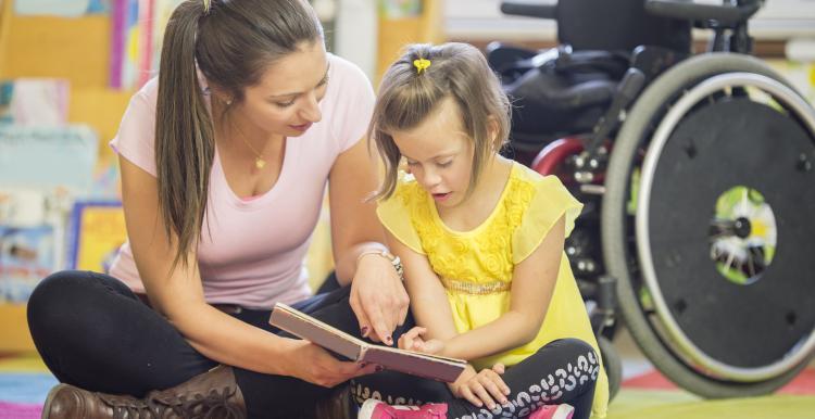 Carer reading with child 