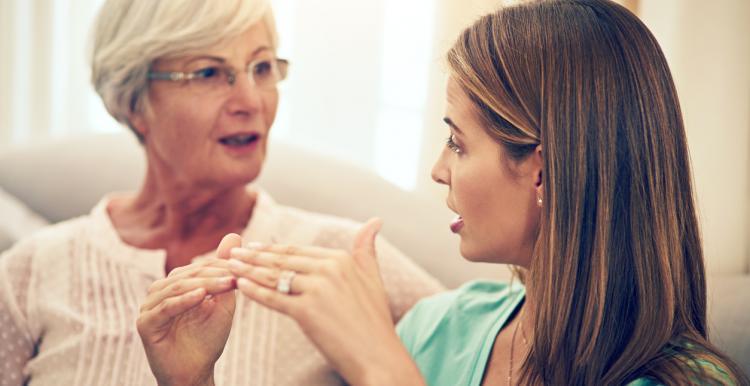 A young woman and an older woman talking 