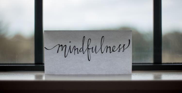Mindfullness note on a window 