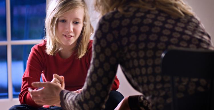 Young woman talking to someone 