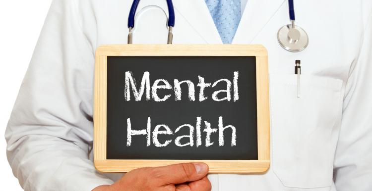 Doctor holding mental health sign 