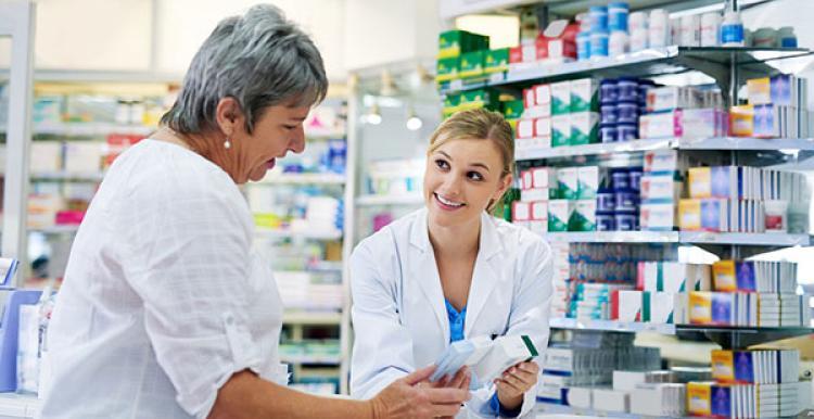 woman talking with pharmacist 