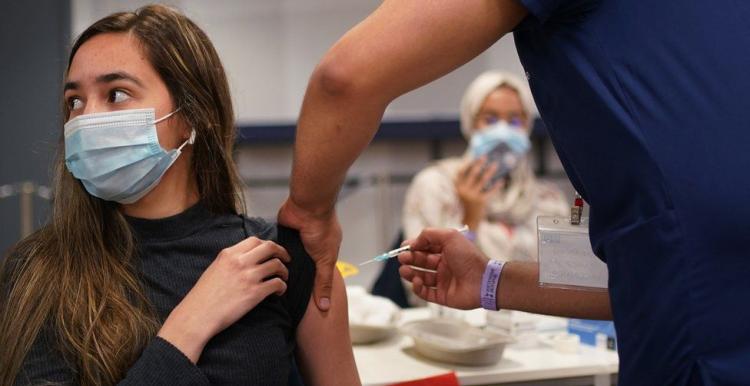 Young woman having  the covid vaccine 