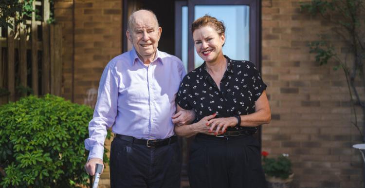 woman caring for older man.
