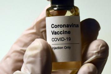 vaccine bottle in a hand