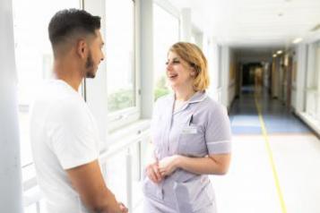 Nurse talking with a young man 