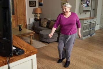 Older lady exercising at home 