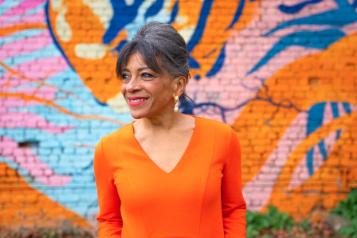 Older woman by street art