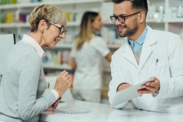 Pharmacist with a member of the public