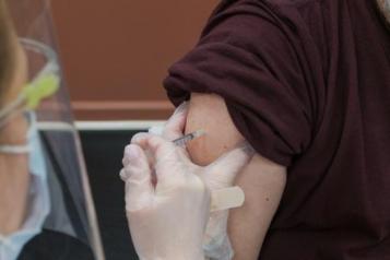 Person receiving vaccination