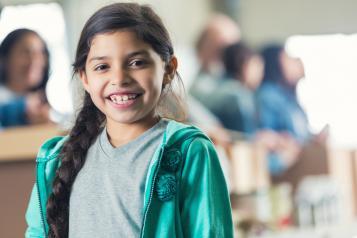 young girl smiling at the camera