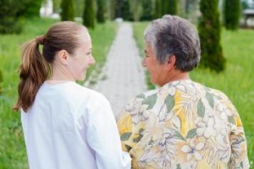 younger woman and an older woman walking 