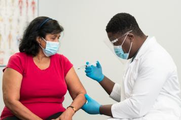 woman having vaccine injection