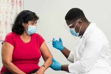 woman having vaccine injection 