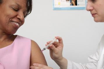 woman having the flu vaccine 