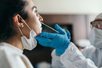 ypoung woman having a covid test
