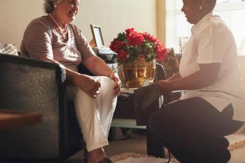 Older lady and social care worker