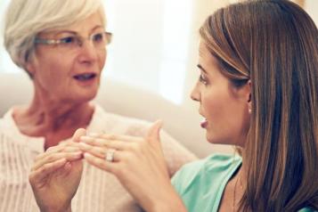 A young woman and an older woman talking 