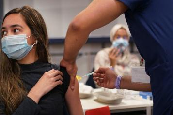 Young woman having  the covid vaccine 