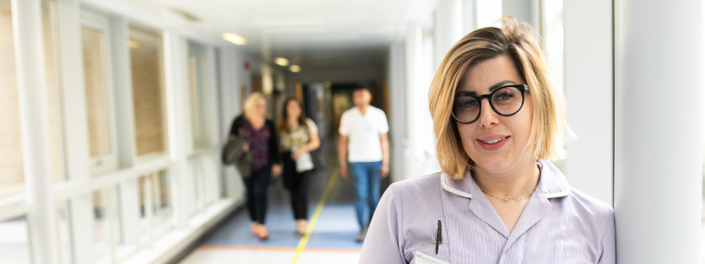 Nurse stood in a hospital corridor
