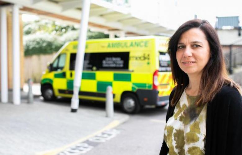 Woman in front of a emergency department 